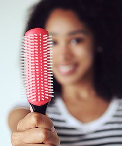 How to Reduce Breakage with a Detangling Brush