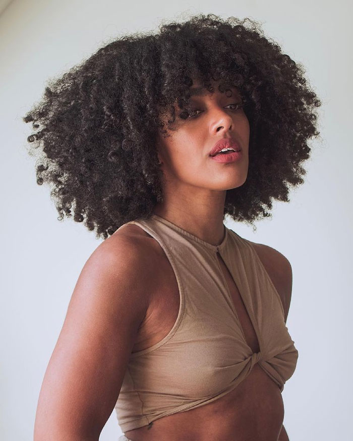 18 Ways to Rock Curtain Bangs on Curly Hair