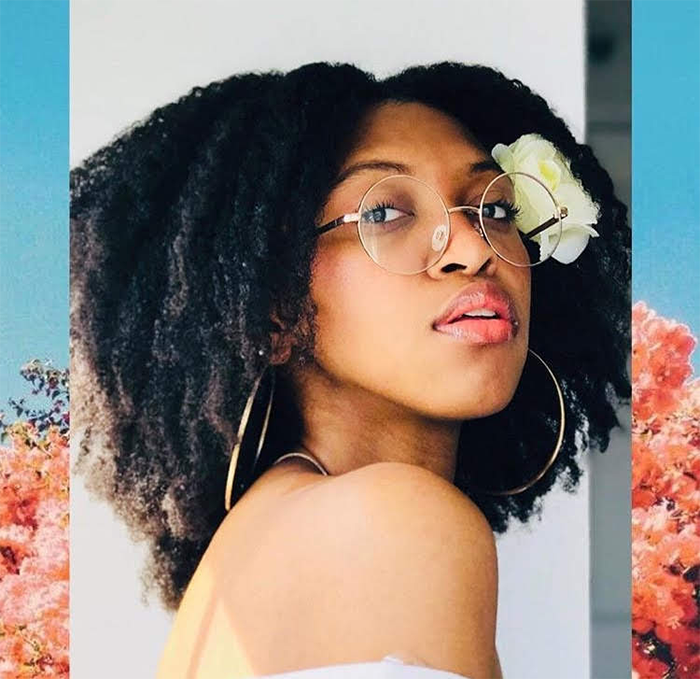 6 Stunning Ways to Add Flowers to Your Curly Hair