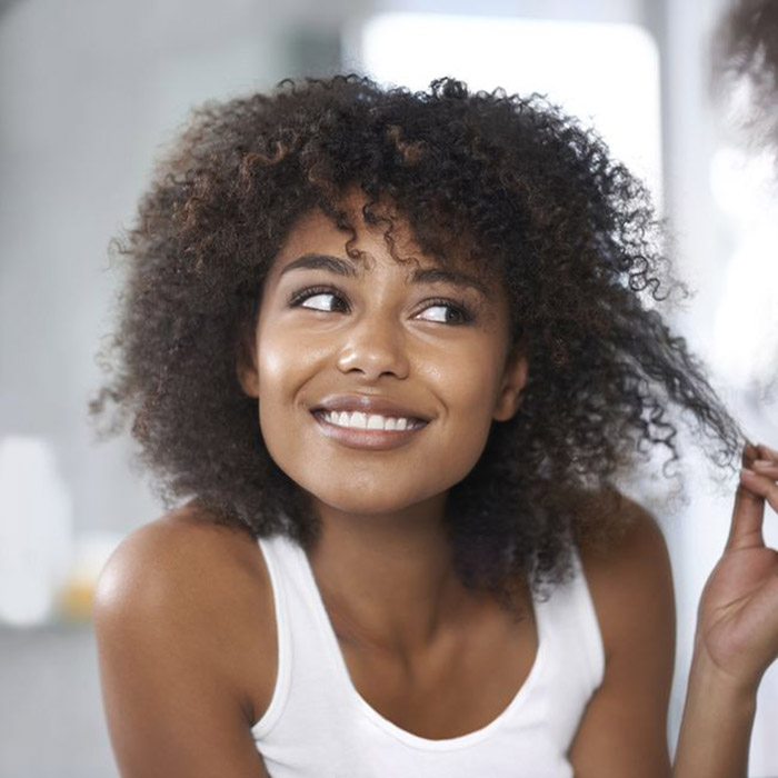 5 Signs to Know Your Curly Hair Needs a Trim