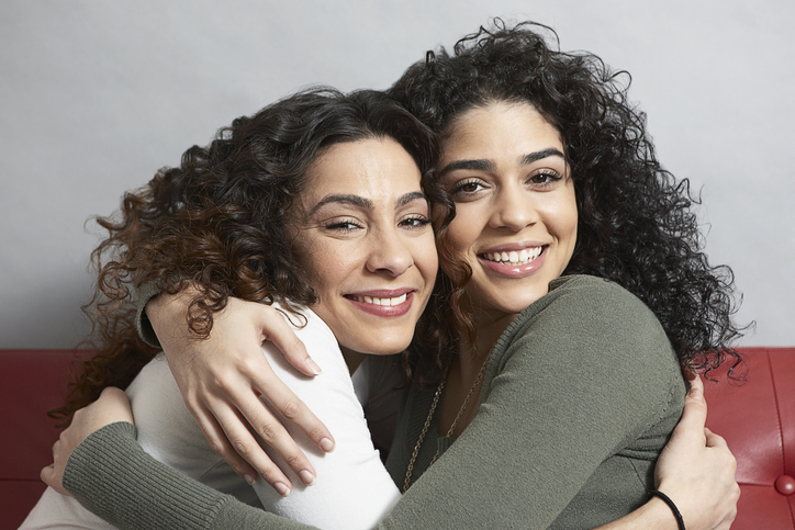 mother and daughter with curly hair
