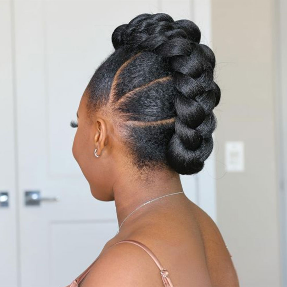 woman with jumbo braids natural hair updo